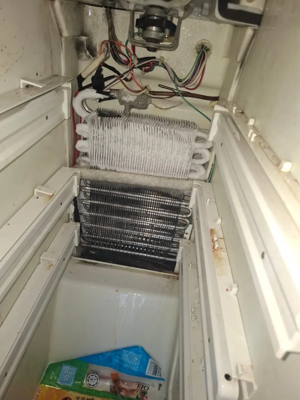 Refrigerator cooling coil inspection
